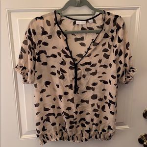 Tan and black patterned blouse